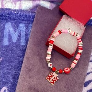 Pink and Red Clay Beaded Bracelet with Enameled Gift Charm and red gift box